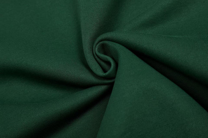 Close-up of dark green fleece fabric with soft knit texture