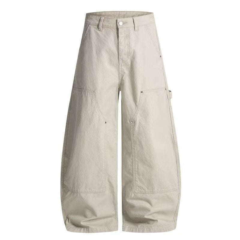 Omirad oversized wide-leg utility pants in ecru with multi-panel seams and large front pockets on white background