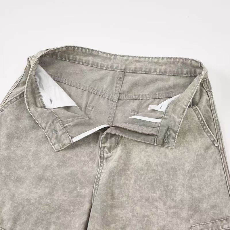 Close-up of open waistband lining and top front of light wash cargo pants