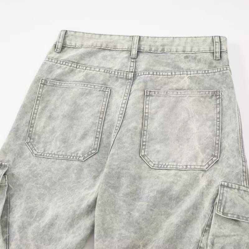 Close-up of light gray jeans back pockets and rear waistband