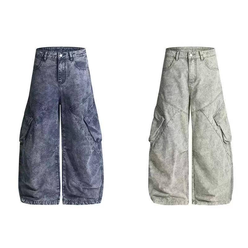SEAKOFF vintage washed wide-leg cargo jeans in washed blue, shown flat with geometric panel seams and oversized flap pockets