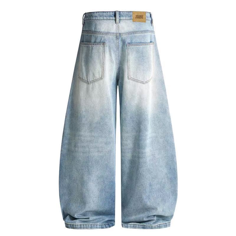 Light wash balloon wide-leg jeans back view with patch pockets and tan label