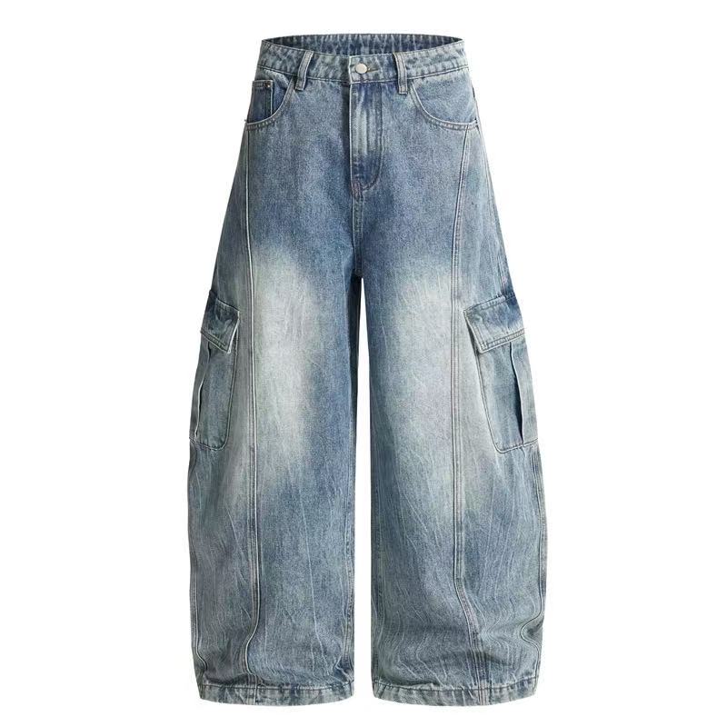 Front view of light blue vintage wash wide-leg cargo jeans with large flap side pockets and relaxed balloon fit