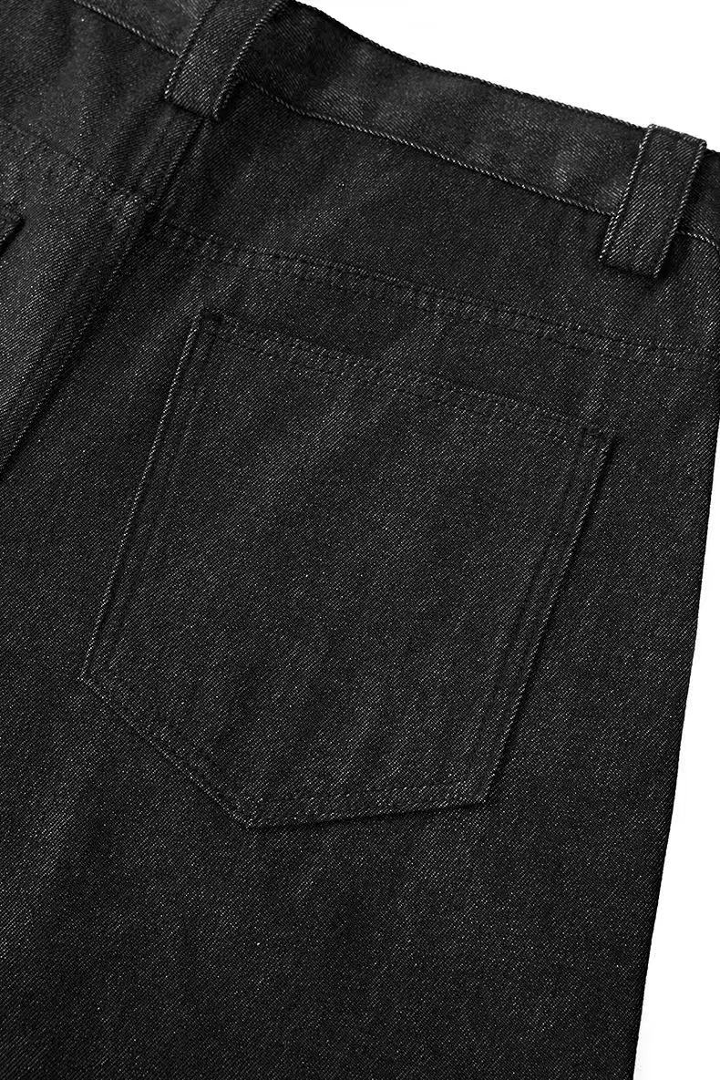 Close-up of black pants back pocket and waistband seam