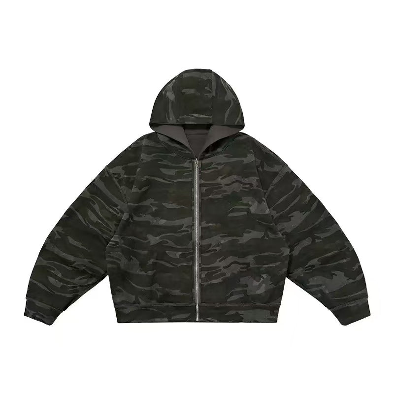 Dark camo reversible zip-up hoodie with adjustable hood and boxy oversized fit, shown from the front