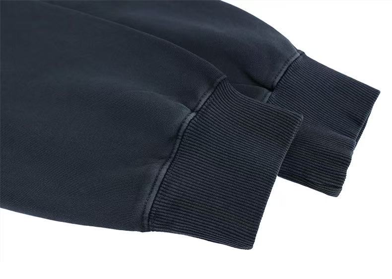 Ribbed black hoodie sleeve cuffs in close-up