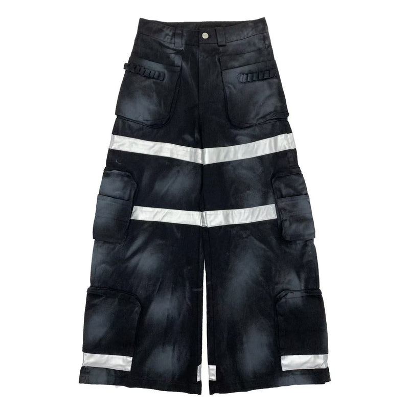 Black wide-leg cargo pants with reflective silver bands and multiple flap pockets, front view