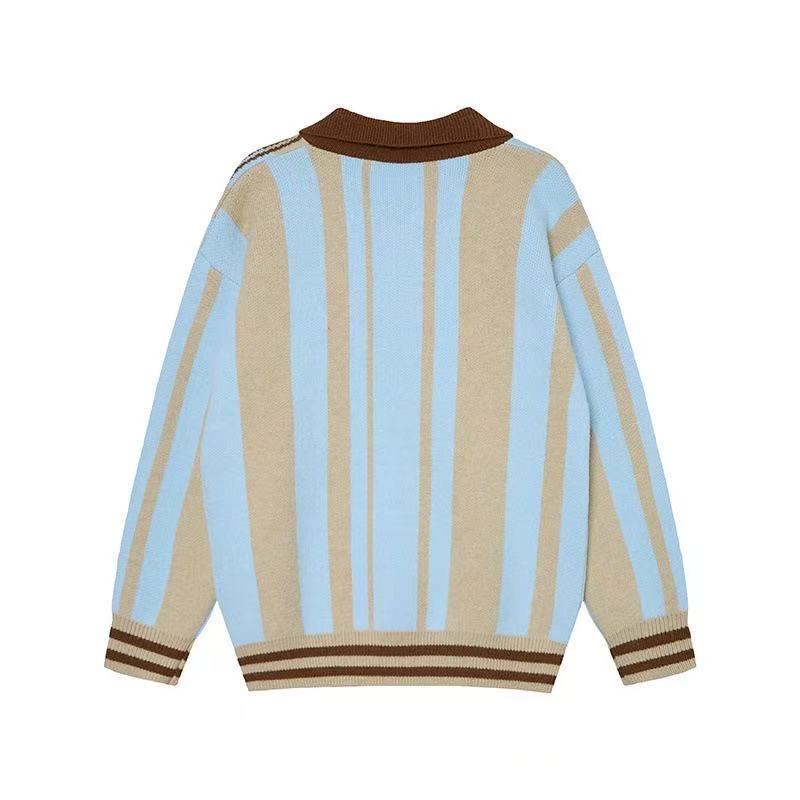 Back view of a beige and light blue striped knit polo sweater with brown collar and hem