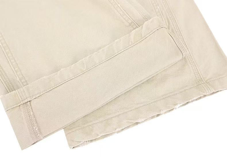 Beige pants hem close-up with stitched rectangular panel