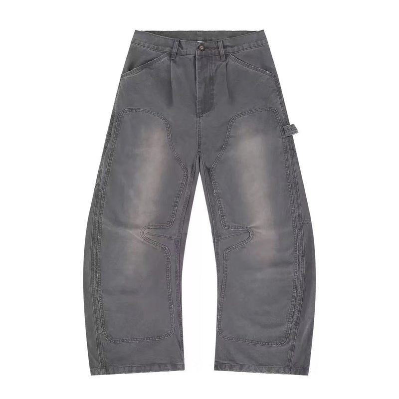 Washed gray wide-leg carpenter pants laid flat with curved panel seams and side loop