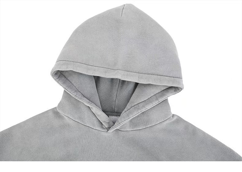 Close-up of gray hoodie hood and neckline with soft fleece texture