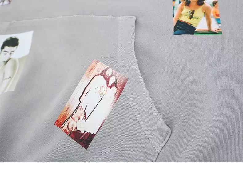 Close-up of gray hoodie front pocket with photo patches and stitched edges