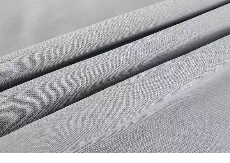 Close-up of gray hoodie gray fabric texture and folded material