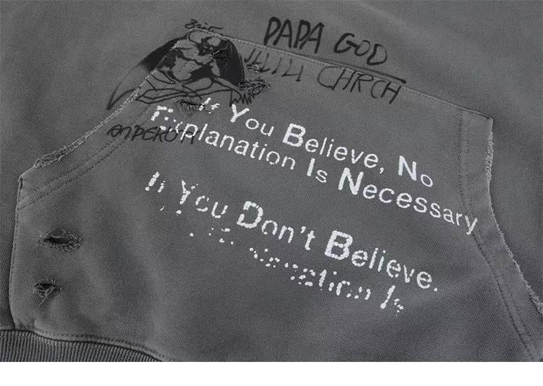 Close-up of gray hoodie front pocket with slogan print and faded graphic details