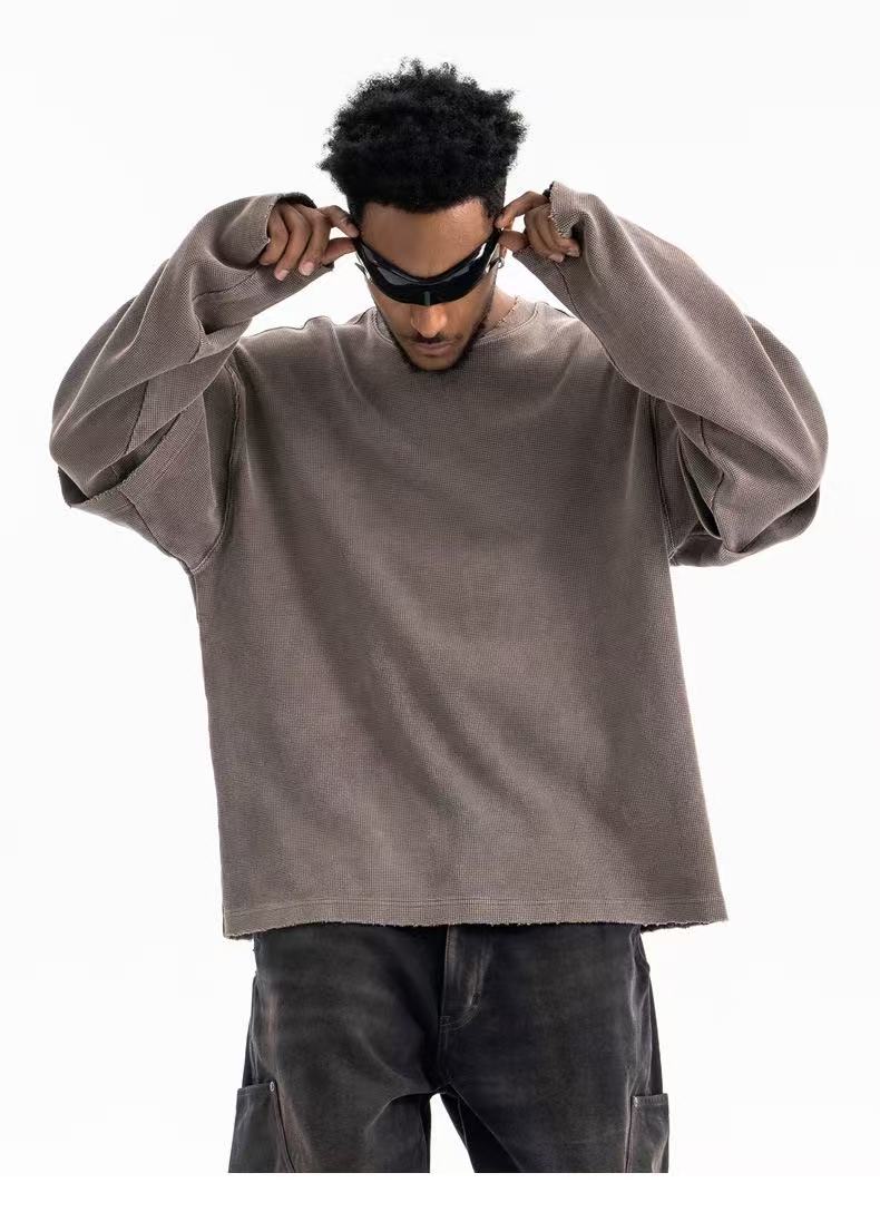 Taupe crewneck sweatshirt close front view with hands adjusting sunglasses