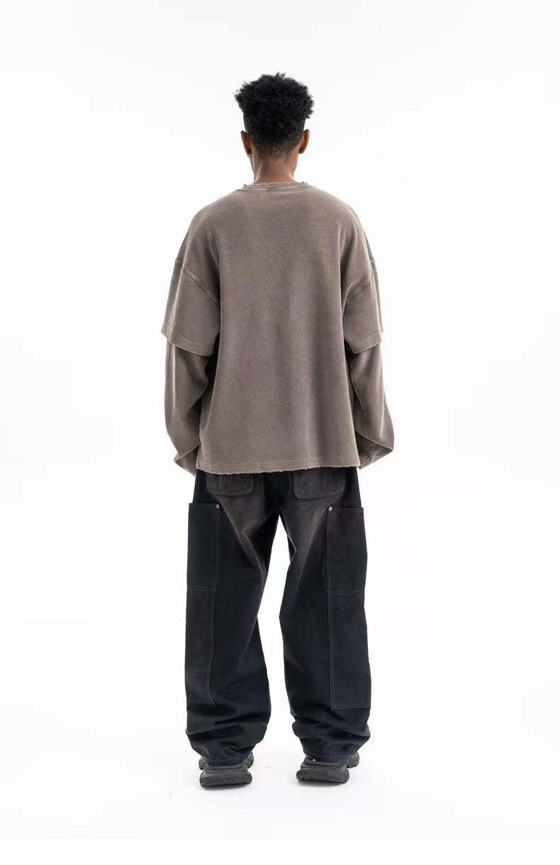 Back view of taupe oversized crewneck sweatshirt worn on model