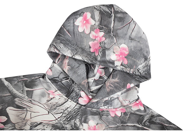 Close-up of gray camo hoodie hood with pink cherry blossom print