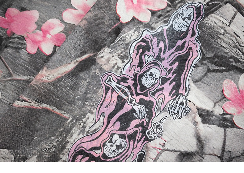 Pink grim reaper graphic on gray camo hoodie fabric with blossom print
