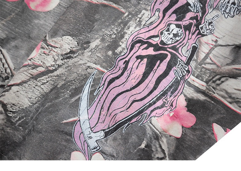 Close-up of pink grim reaper print holding a scythe on gray camo hoodie