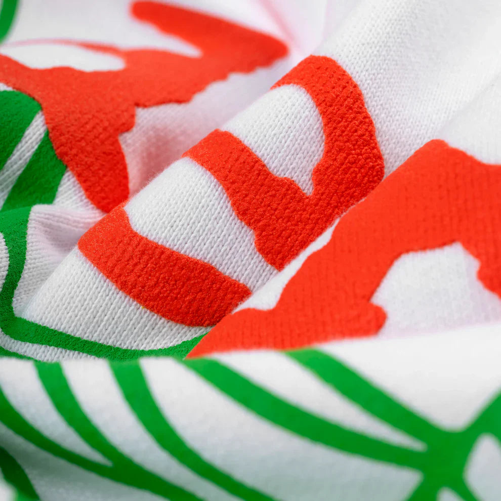 A close-up of the Sp5der “Toxic Web” Hoodie in White & Neon Lime, showcasing 440GSM heavyweight cotton fleece with bold neon graphics, textured raised lettering, and visible folds and creases in the oversized streetwear pullover.