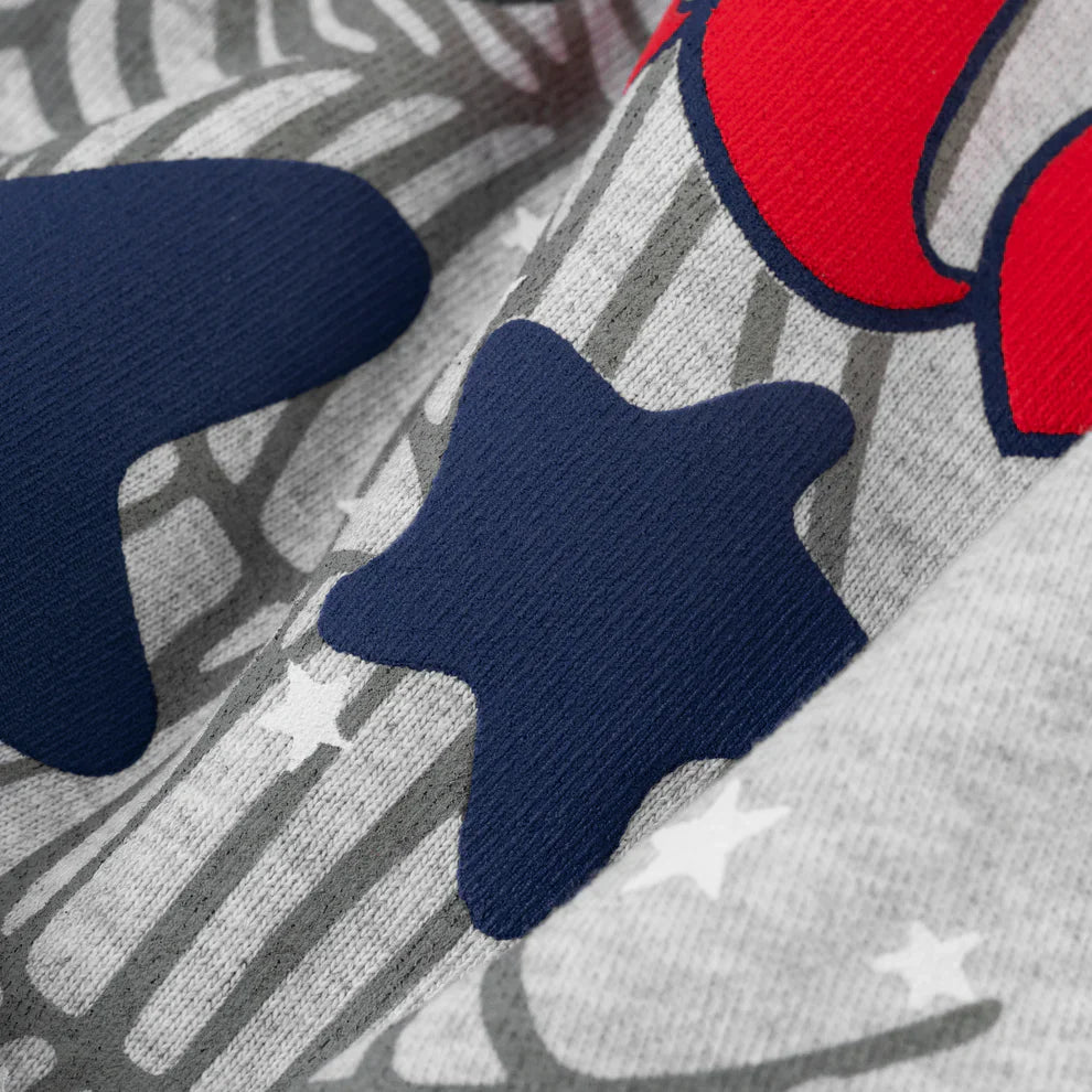 Close-up of soft, textured gray fabric from the Sp5der Atlanta Web Zip Hoodie – Grey 440GSM Heavyweight Streetwear, featuring a bold printed design with blue and red stars, gray patterns, and small white stars—ideal for graphic zip hoodie fans.