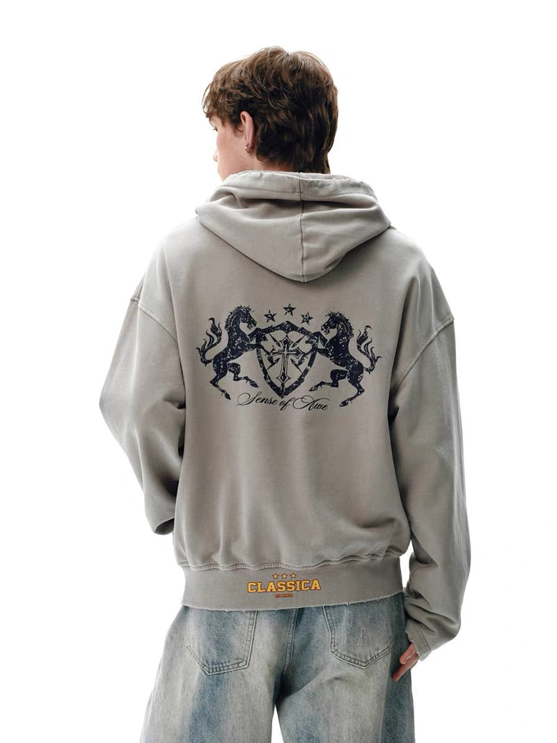 Light gray washed zip hoodie worn by model, back view with large crest graphic