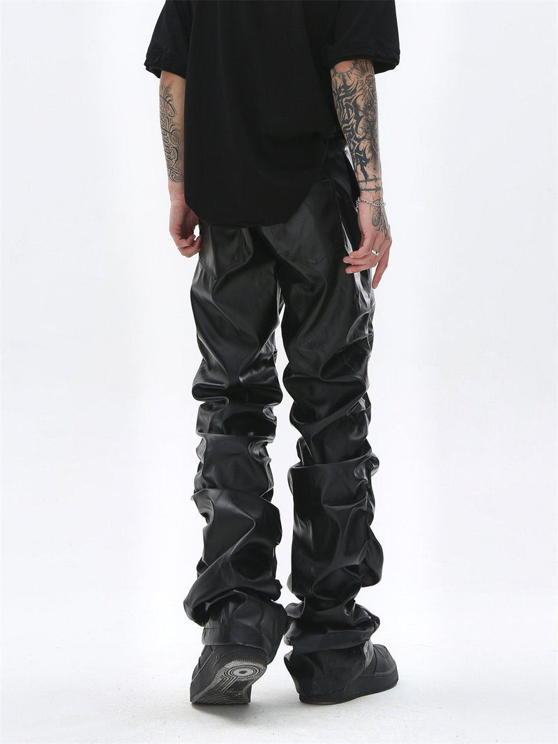 Black faux leather straight-leg pants worn back view, with ruched legs and patch pockets