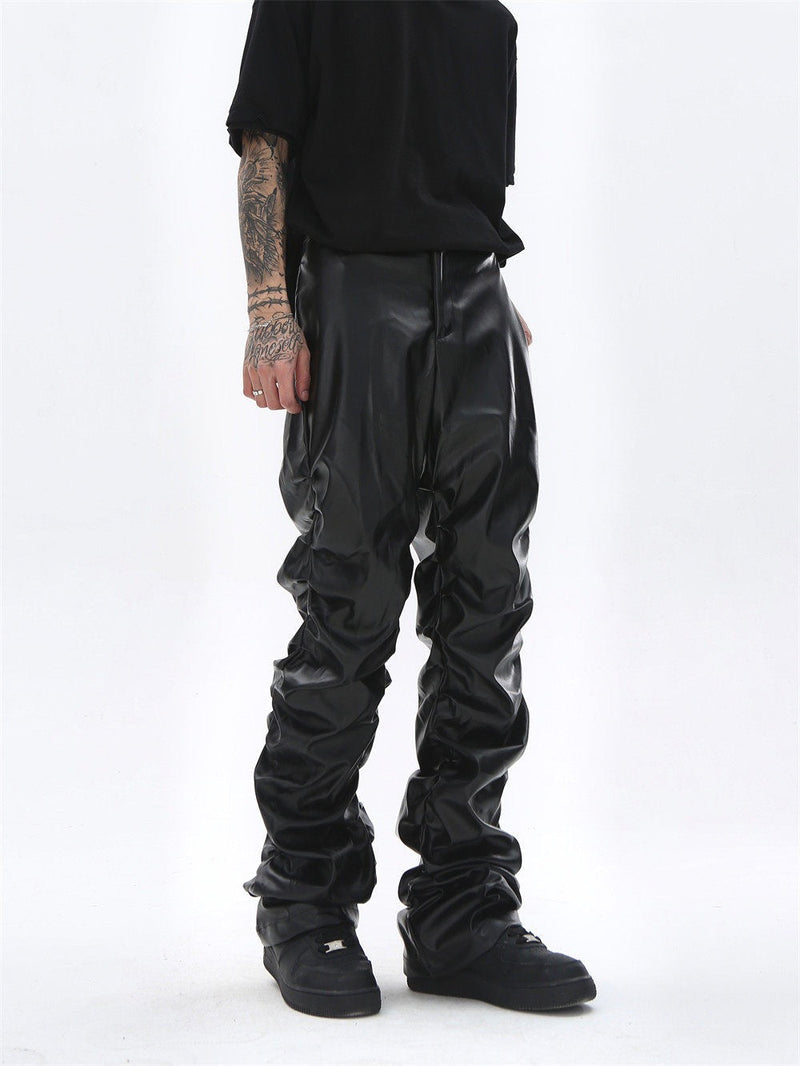 Black faux leather straight-leg pants worn front view, showing smooth waist and gathered legs