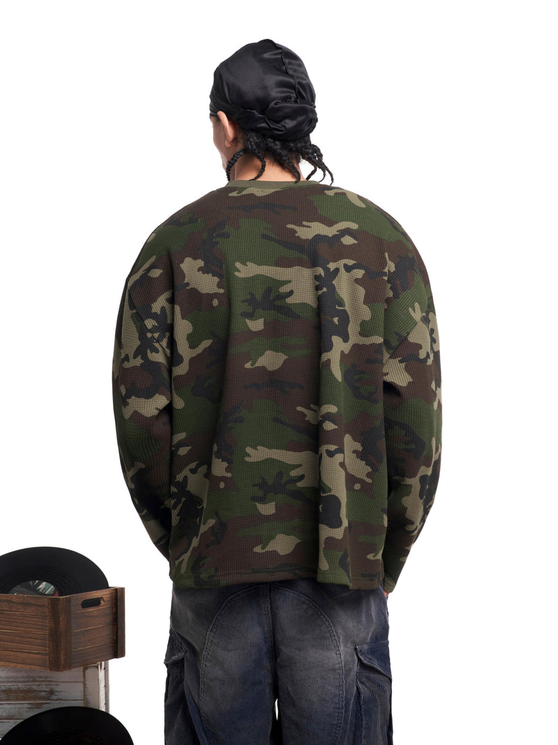 Back view of camo long sleeve sweatshirt on model, waffle knit texture visible