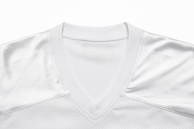 Close-up of white jersey V-neck collar and satin shoulder seams