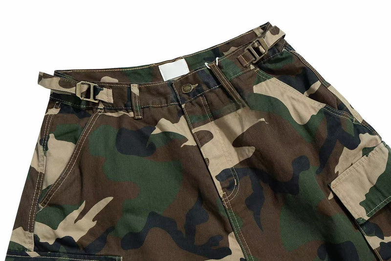 Top front view of camouflage cargo shorts showing belt, button closure, and waist details