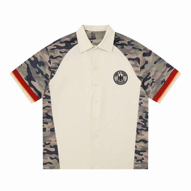 Cream button-up shirt with camo panel sleeves, red trim cuffs, and circular eagle chest patch