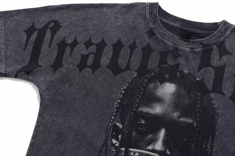 Vintage washed black gothic graphic T-shirt with bold faded lettering and a dark portrait print on the front