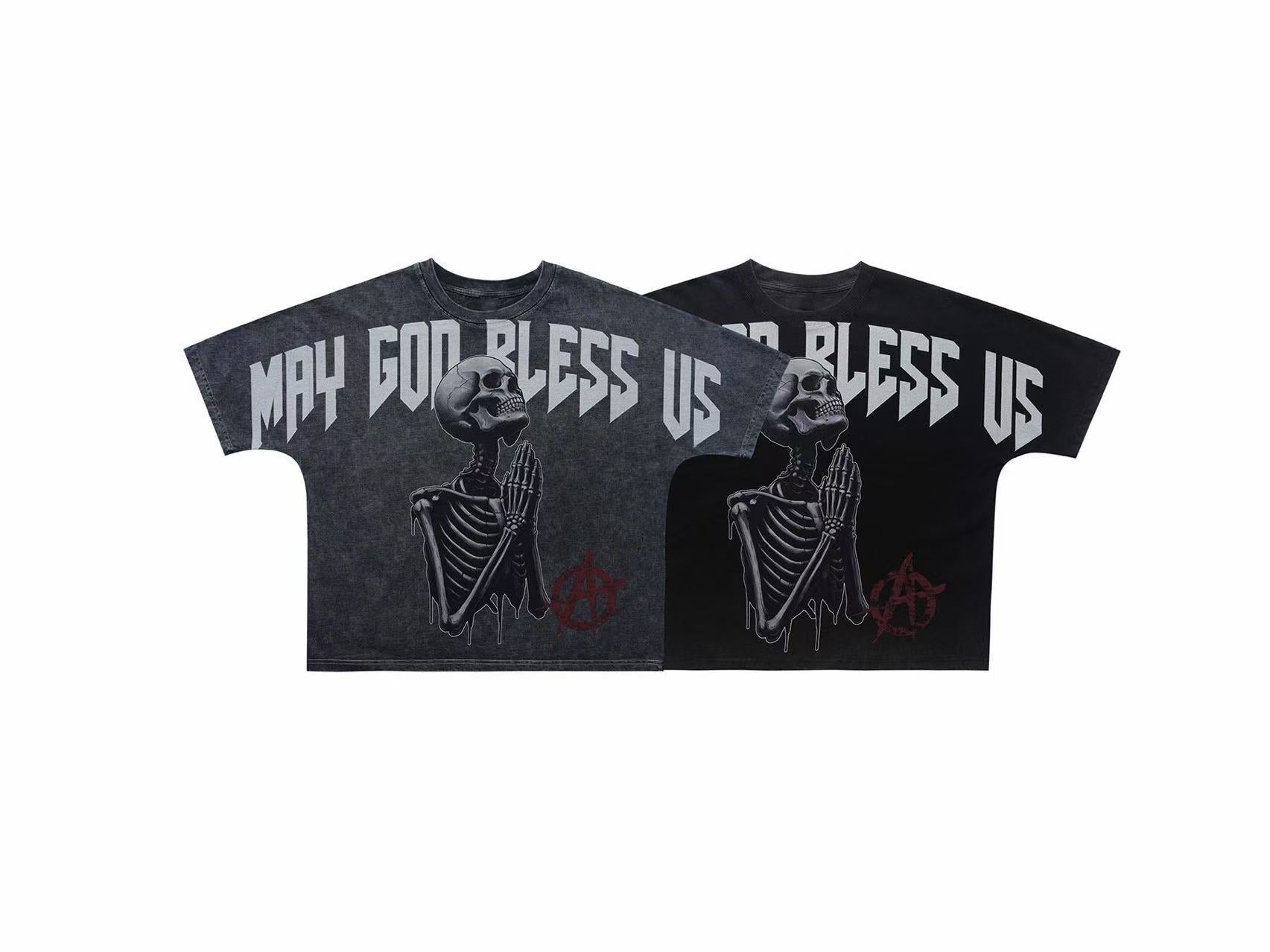 Black oversized graphic tee with praying skeleton and MAY GOD BLESS US gothic typography print on the front