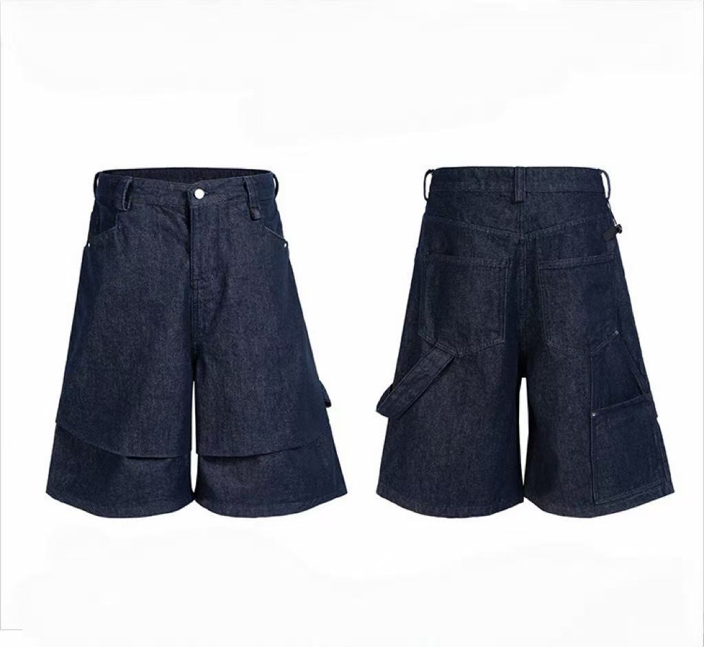 Front and back view of dark indigo layered utility denim shorts with cargo pockets and double-layer hem panel