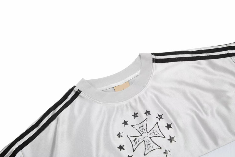 White mesh sport tee with black shoulder stripes and a gothic star graphic on the chest