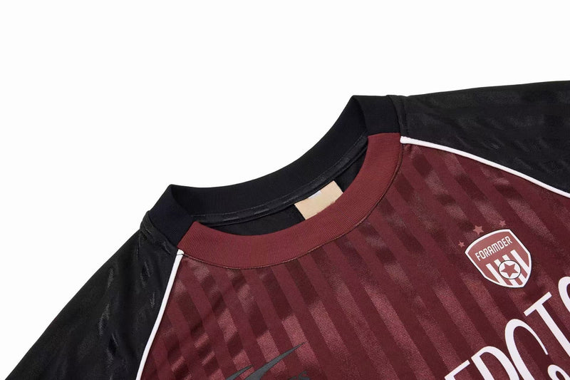 Black and burgundy striped football jersey tee with ribbed collar, white piping, and FORAMDER crest detail