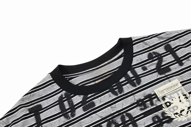 Black ribbed collar graphic T-shirt with gray graffiti stripes and bold streetwear print on white background