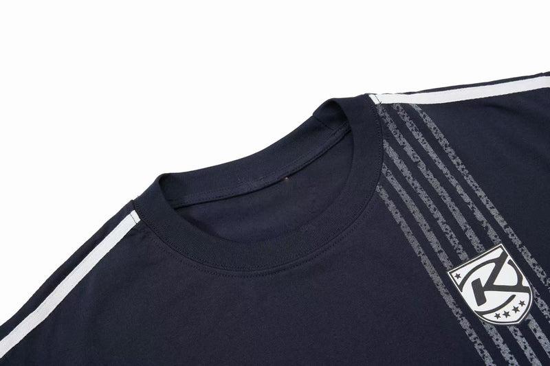 Navy sport tee with white shoulder stripes, vertical graphic detailing, and a crest logo on the chest