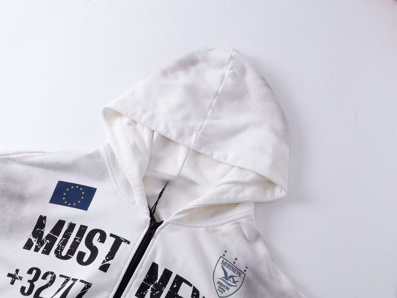 Close-up of white hoodie hood and upper chest showing EU-style flag patch, zipper, and distressed print
