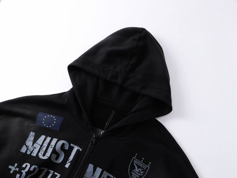 Close-up of black hoodie hood and upper chest showing EU-style flag patch, zipper, and graphic print