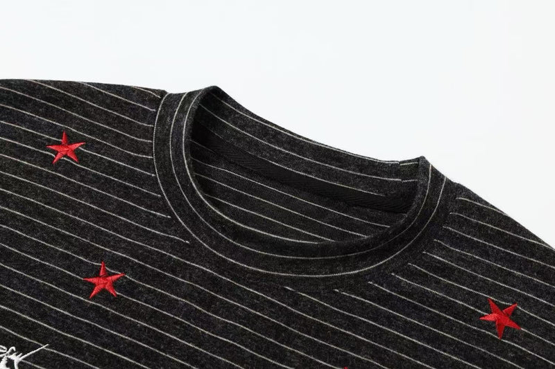 Black pinstripe streetwear tee with red embroidered stars and a ribbed crew neckline, Seakoff Pegasus design