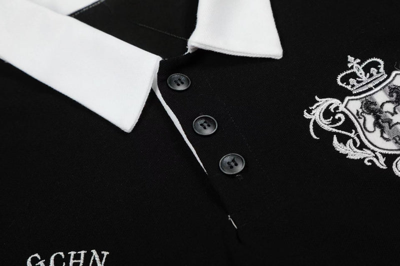 Black and white striped polo shirt with embroidered crest, button placket, and classic collar detail