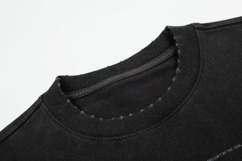Black vintage washed graphic T-shirt with distressed ribbed crew neck and faded print detail