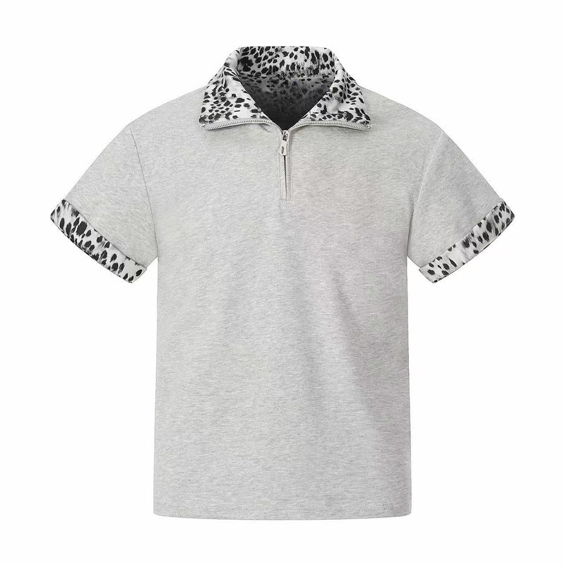 Light gray quarter-zip polo shirt with leopard print collar and sleeve trim on a clean white background