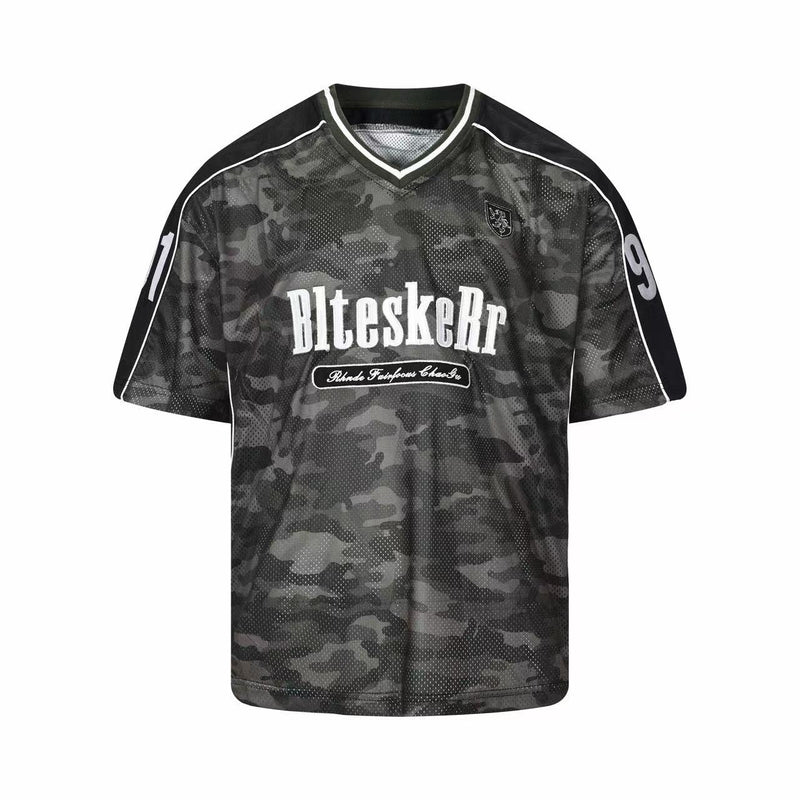 Dark camo mesh football jersey with white trim, V-neck, and bold front lettering on a black athletic shirt