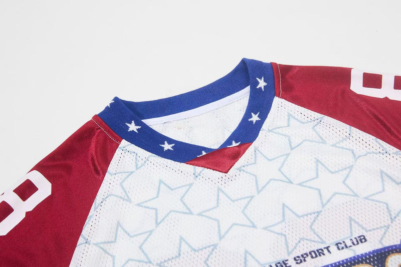 Red, white, and blue mesh football jersey with star print, varsity-style number graphics, and ribbed blue collar