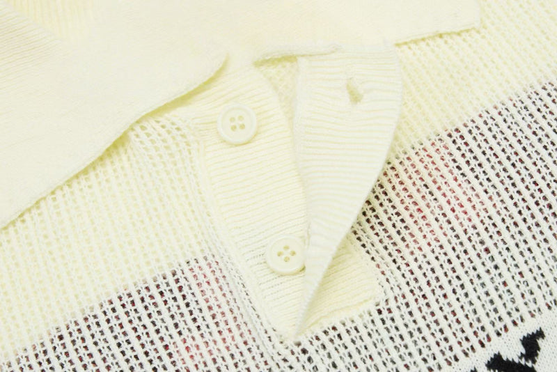 Close-up of a cream knit polo collar with buttons and varsity-style mesh stripe detailing