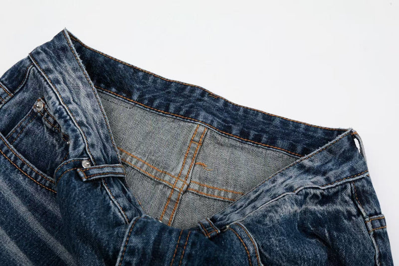 Close-up of the waistband interior and back yoke on blue denim jeans