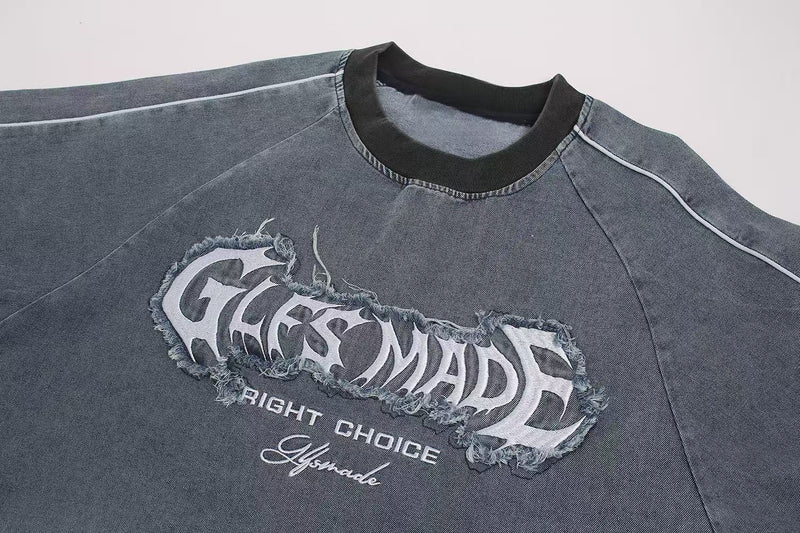Vintage washed gray streetwear T-shirt with distressed graphic print and black ribbed collar